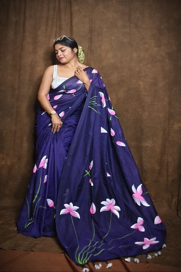 blue khadi lotus handpainted saree draped on model showing side view by swamini sarees