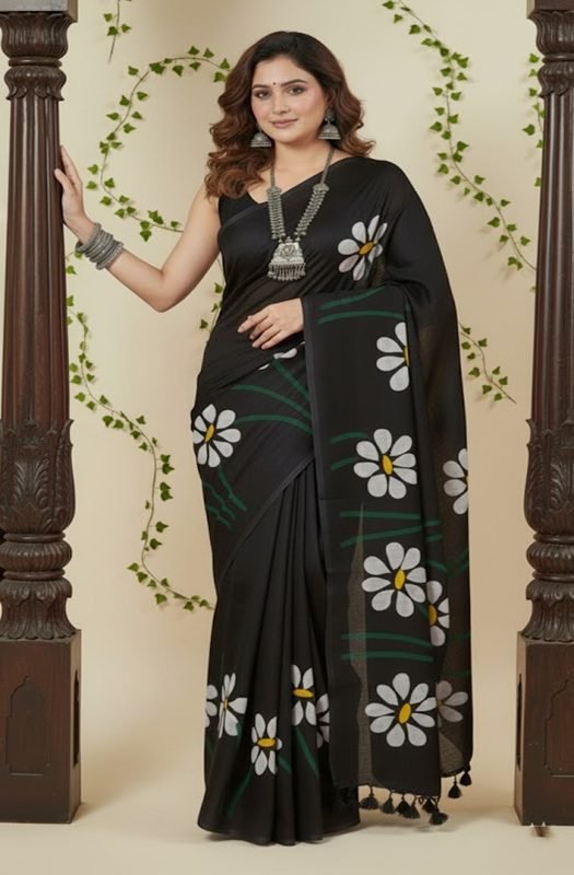Woman draping a soft black mul saree with handpainted white daisy flowers, showing lightweight and breathable texture perfect for office wear draped on model by swamini sarees