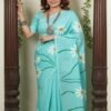 Woman wearing a lightweight blue handpainted Mul saree with daisy flowers draped n a casual style by swamini sarees