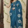 Teal blue Mul cotton saree featuring handpainted white daisy floral motifs for summer wear by swamini sarees