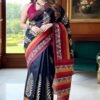 black tussar silk saree front view draped on model by swamini sarees