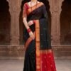 elegant black and red cotton silk maheshwari saree light weight breathable traditional draped on model front view by swmaini sarees