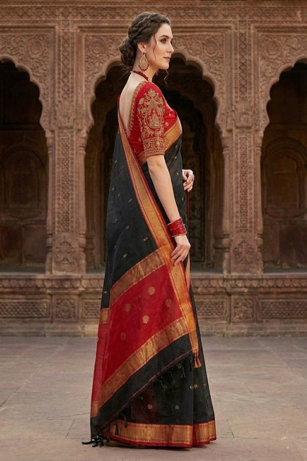 elegant black and red cotton silk maheshwari saree light weight breathable traditional draped on model side view by swmaini sarees